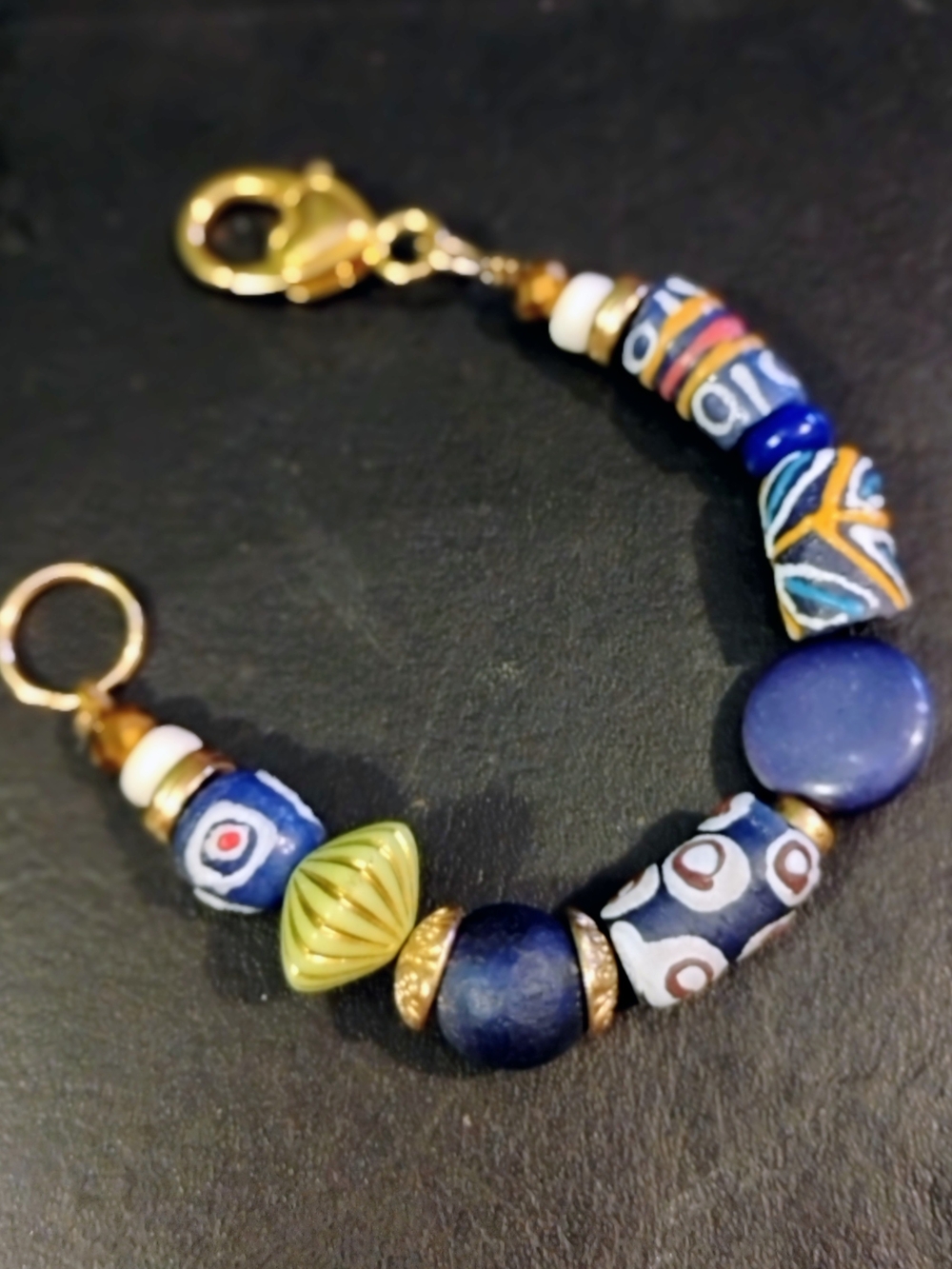 Hand Crafted Multicolor Bead Bracelet with Blue and Gold Accents